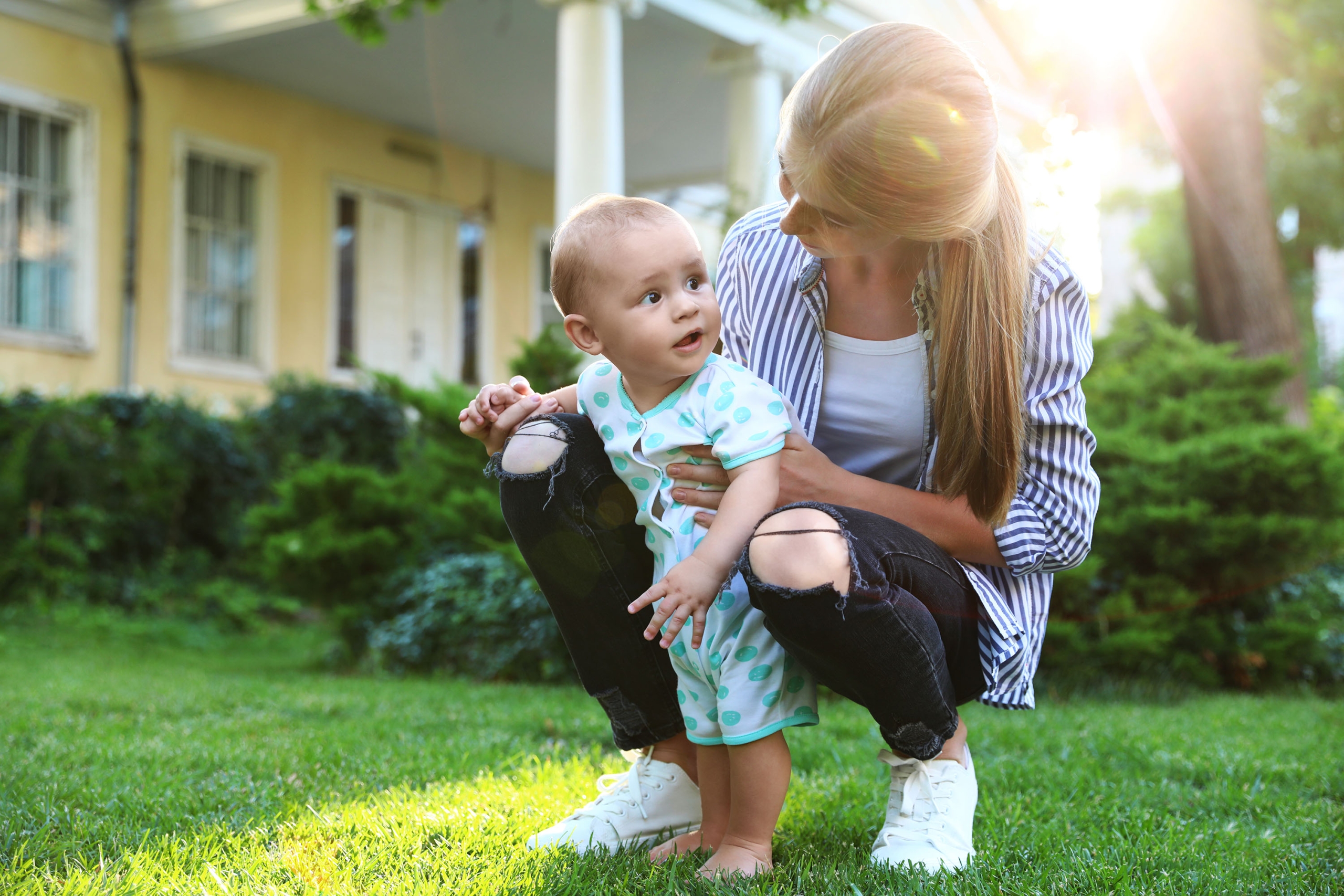 Teen,Nanny,With,Cute,Baby,On,Green,Grass,Outdoors